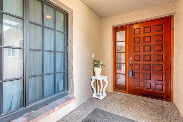 view of exterior entry featuring french doors