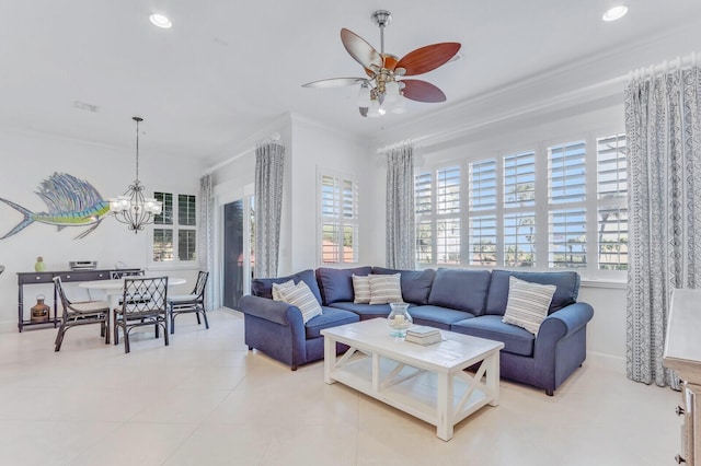 tiled living room featuring crown molding and ceiling fan with notable chandelier