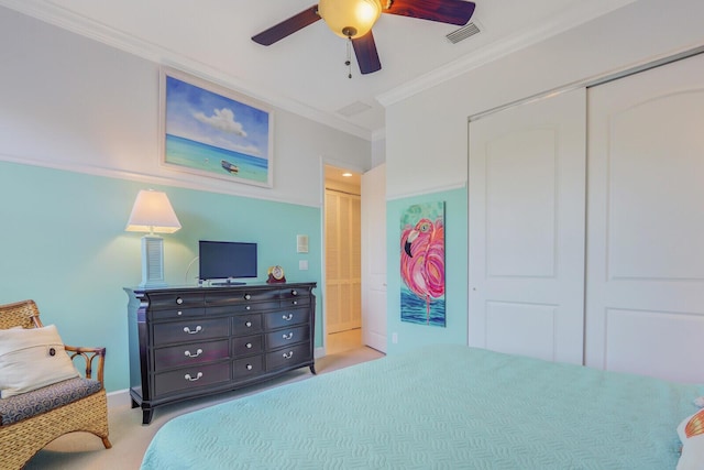 bedroom with ceiling fan, light colored carpet, and ornamental molding