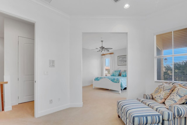 carpeted bedroom featuring multiple windows, ceiling fan, and ornamental molding