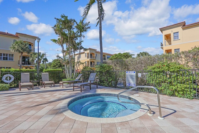 view of pool featuring a hot tub