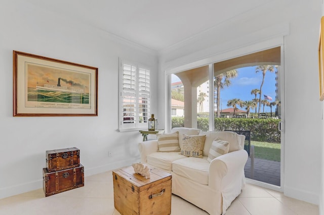 living room featuring light tile patterned flooring and ornamental molding