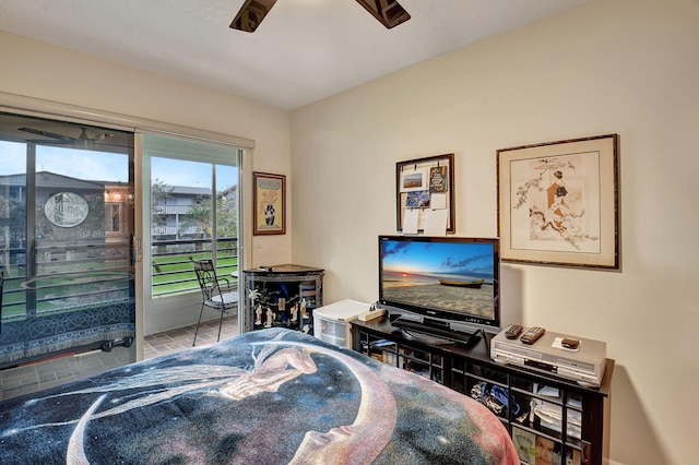 bedroom featuring access to exterior, ceiling fan, and light tile patterned floors