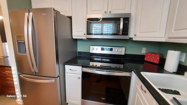 kitchen featuring white cabinetry, sink, and stainless steel appliances