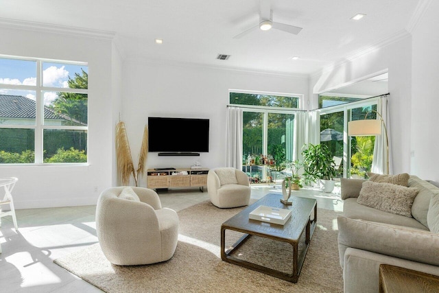 tiled living room featuring crown molding and ceiling fan