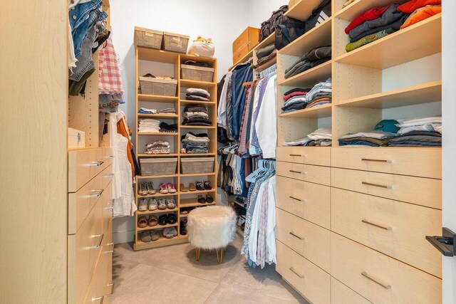 spacious closet with tile flooring