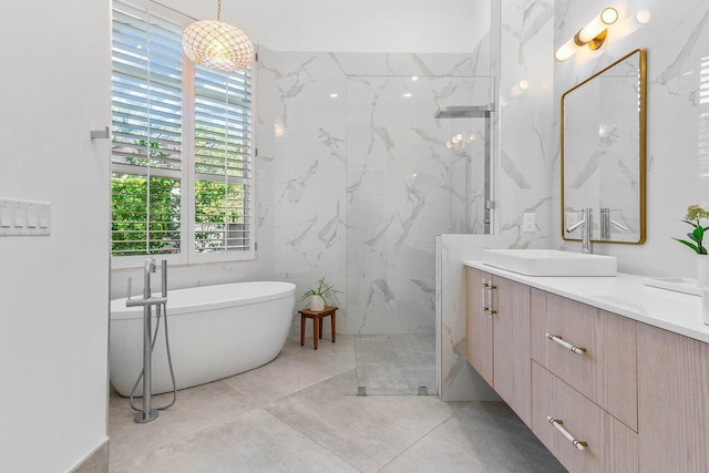 bathroom with tile walls, independent shower and bath, tile floors, and vanity