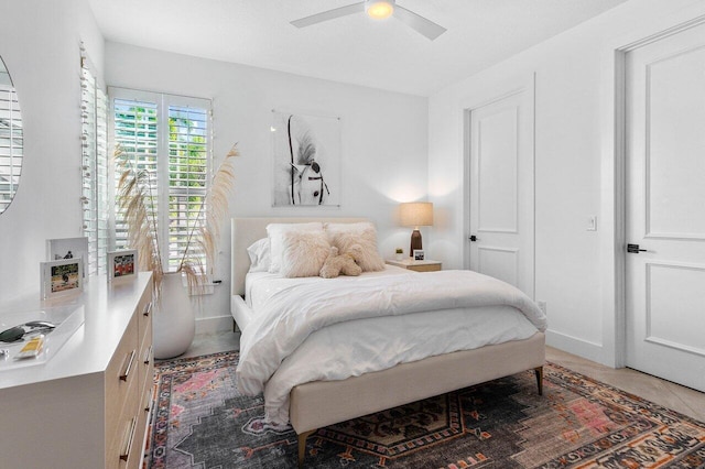 tiled bedroom with ceiling fan