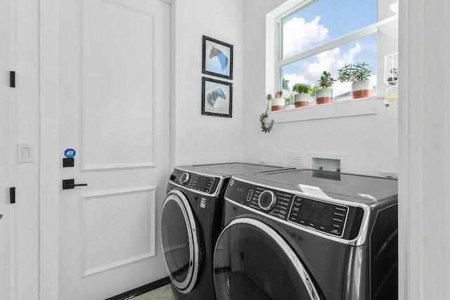 washroom featuring washer hookup and separate washer and dryer