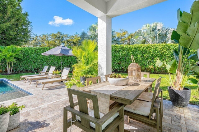 view of swimming pool featuring a patio area, a yard, pool water feature, and an in ground hot tub