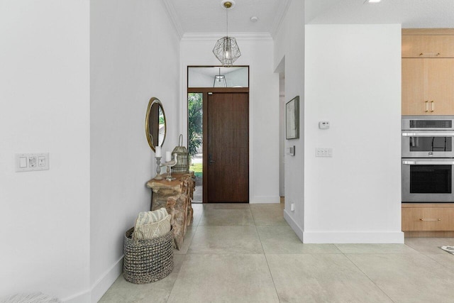 entryway featuring ornamental molding