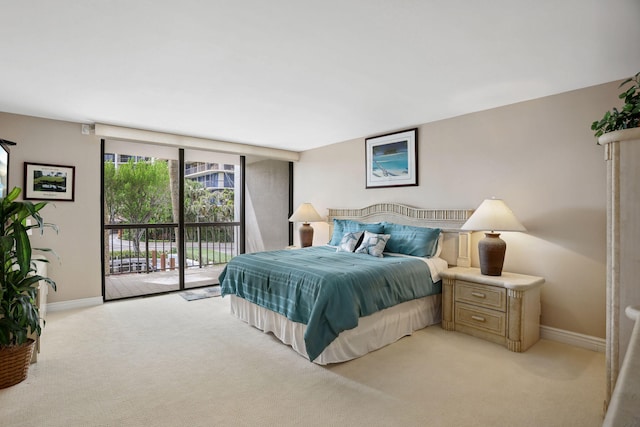 carpeted bedroom featuring access to exterior