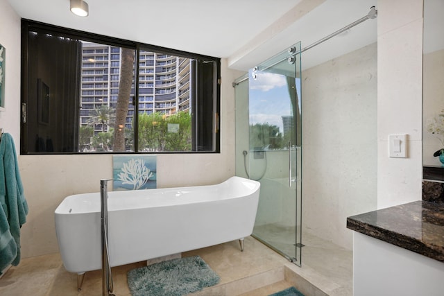 bathroom featuring independent shower and bath and tile flooring