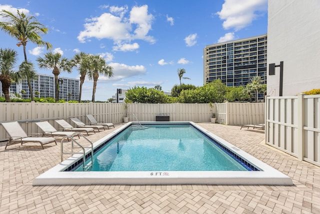 view of pool featuring a patio area