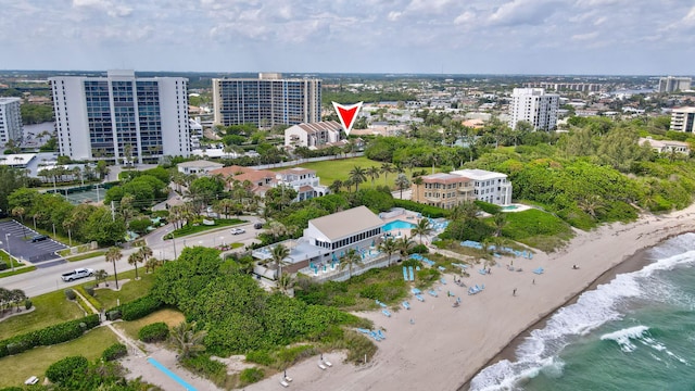 bird's eye view featuring a water view and a view of the beach