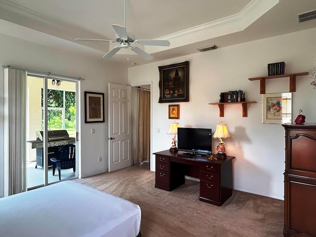 carpeted bedroom featuring ceiling fan, a raised ceiling, access to outside, and ornamental molding