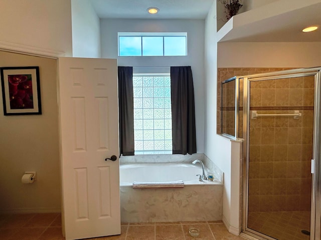 bathroom featuring shower with separate bathtub and tile patterned floors