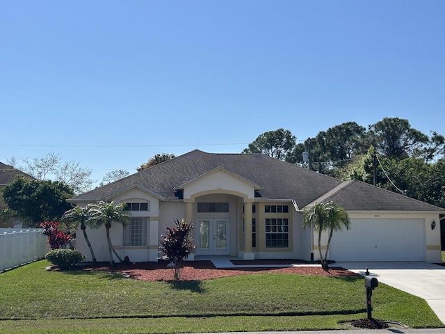 ranch-style house featuring a front yard, french doors, fence, and stucco siding