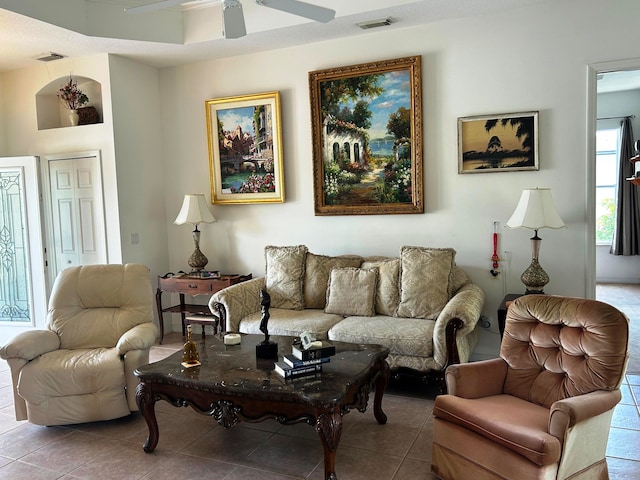 tiled living room featuring ceiling fan