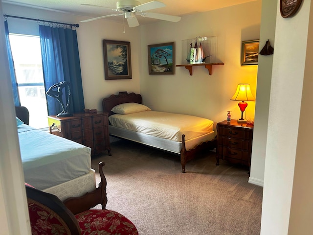 bedroom featuring ceiling fan and carpet floors