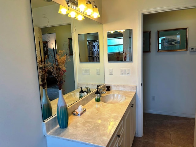 bathroom featuring tile patterned flooring and vanity