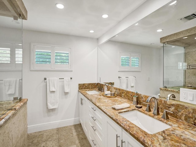 bathroom featuring tile flooring, dual bowl vanity, and a wealth of natural light