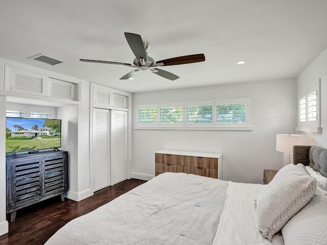 bedroom featuring a closet, ceiling fan, and dark hardwood / wood-style floors