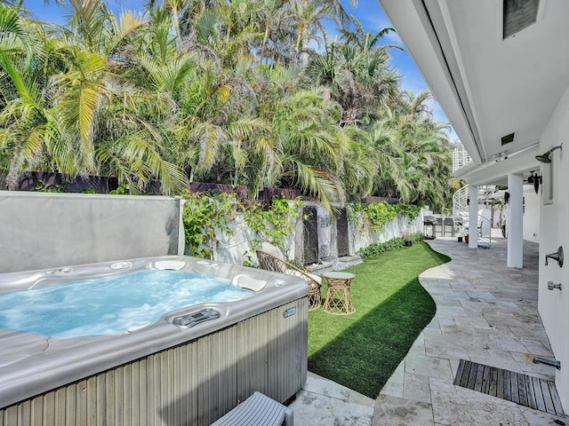 view of pool featuring a patio, a hot tub, and a yard