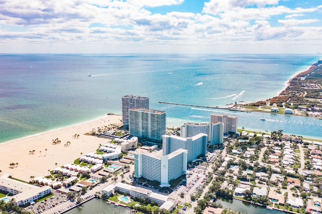 birds eye view of property featuring a water view and a view of the beach