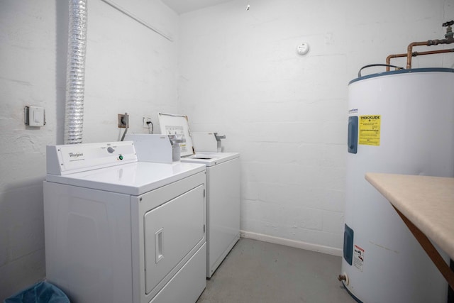 washroom with water heater, hookup for an electric dryer, and washer and clothes dryer