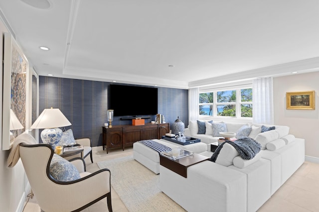 living room featuring a raised ceiling and light tile floors