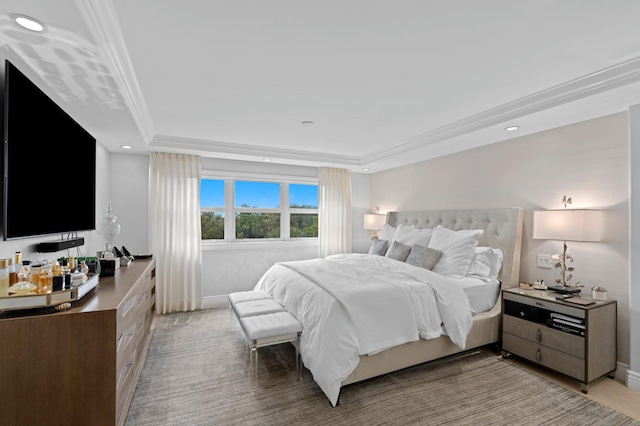 bedroom featuring crown molding and a tray ceiling