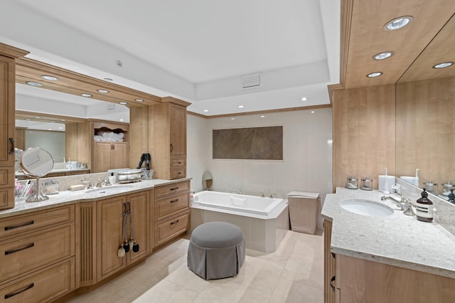 bathroom featuring tile flooring, a bath, and vanity