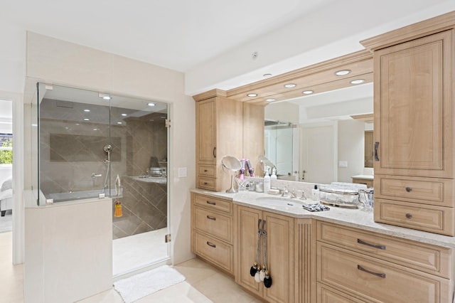 bathroom featuring a shower with door, vanity, and tile flooring