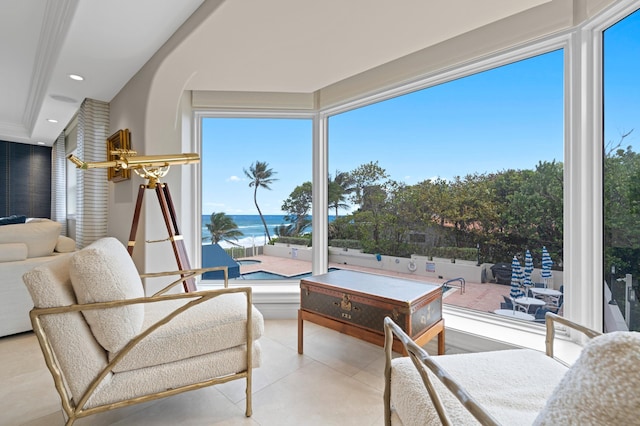 sunroom / solarium with a water view