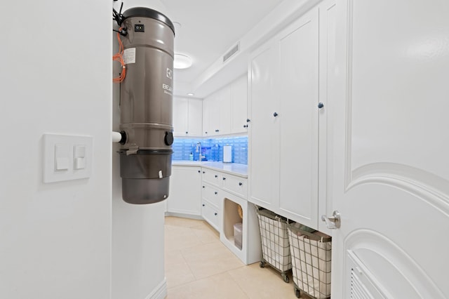 interior space featuring sink and light tile floors