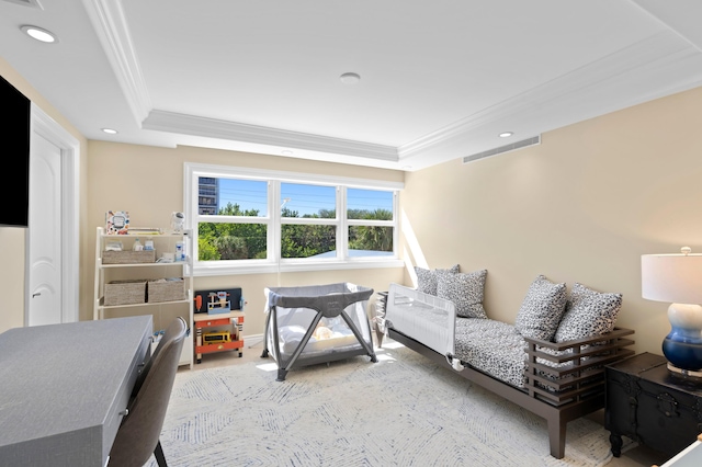 bedroom featuring light colored carpet, crown molding, and a raised ceiling