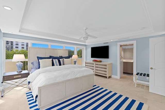 tiled bedroom featuring connected bathroom, ceiling fan, and a tray ceiling