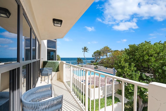 balcony featuring a water view