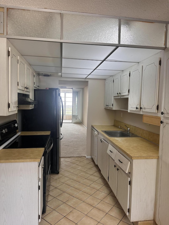 kitchen with light carpet, white cabinetry, black electric range, dishwasher, and sink