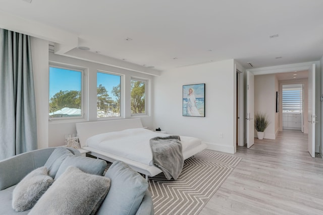 bedroom with light wood-type flooring