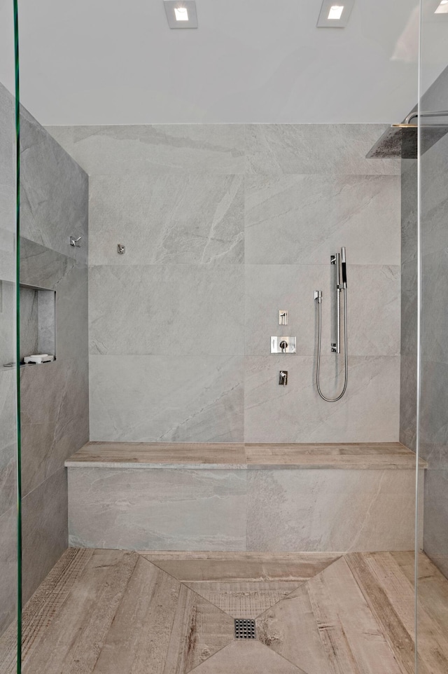 bathroom with a tile shower