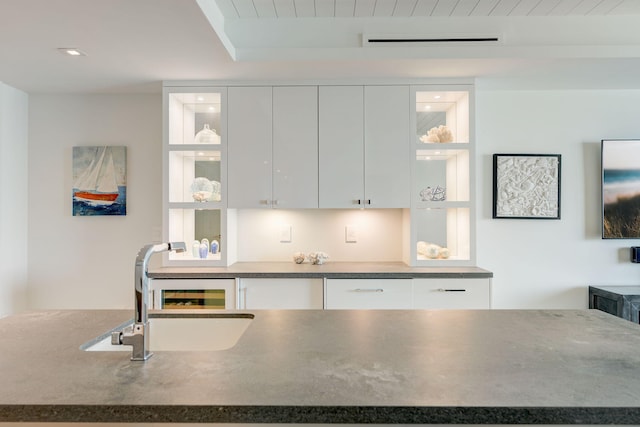 kitchen with sink and white cabinetry