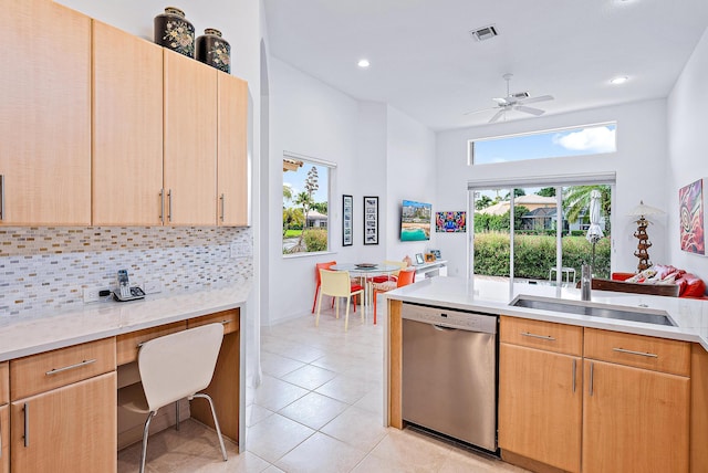 kitchen with light tile flooring, ceiling fan, light brown cabinetry, backsplash, and dishwasher