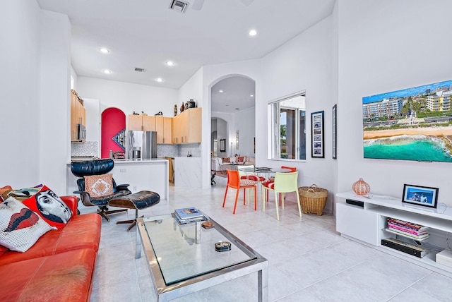 living room featuring light tile floors