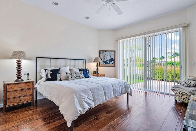 bedroom featuring ceiling fan, dark hardwood / wood-style floors, and access to exterior