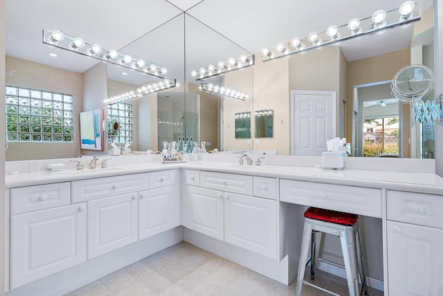 bathroom with double sink vanity and tile floors