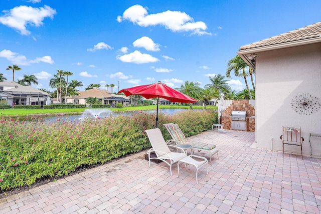 view of terrace featuring a grill and exterior kitchen