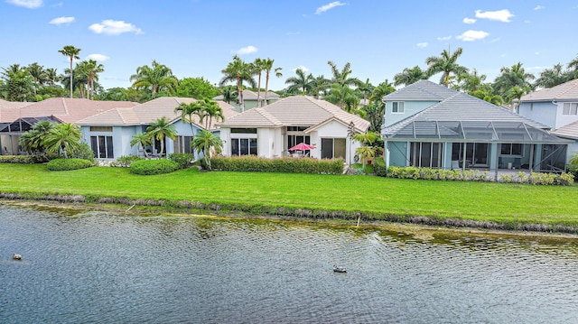 exterior space with a yard and a water view