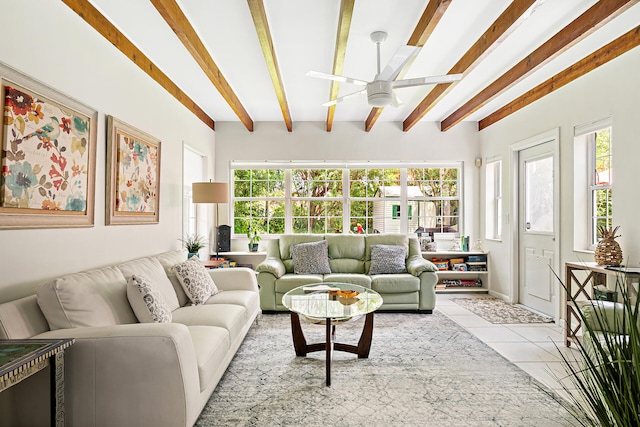 living room with ceiling fan, light tile patterned floors, and beam ceiling